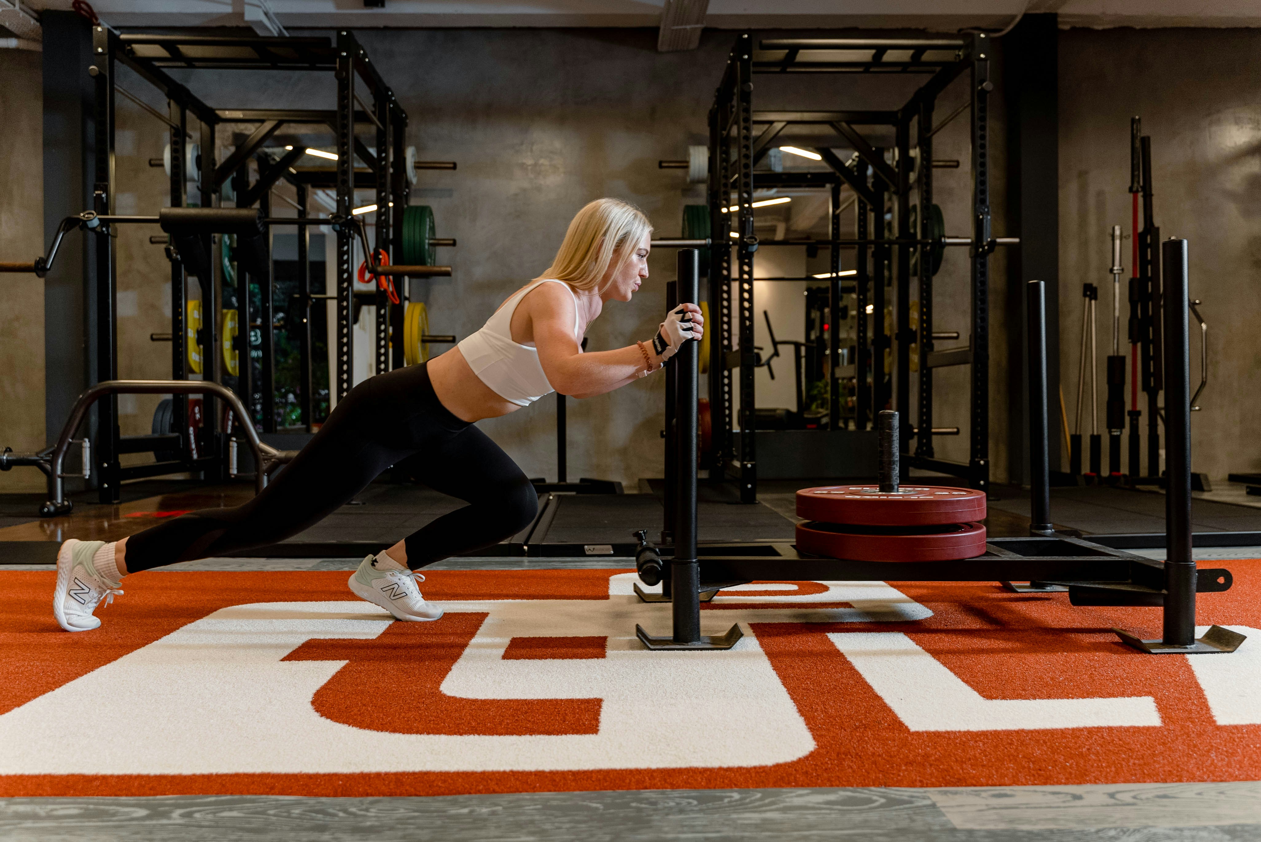 ATLAS functional training zone with turf, rigs, and sleds