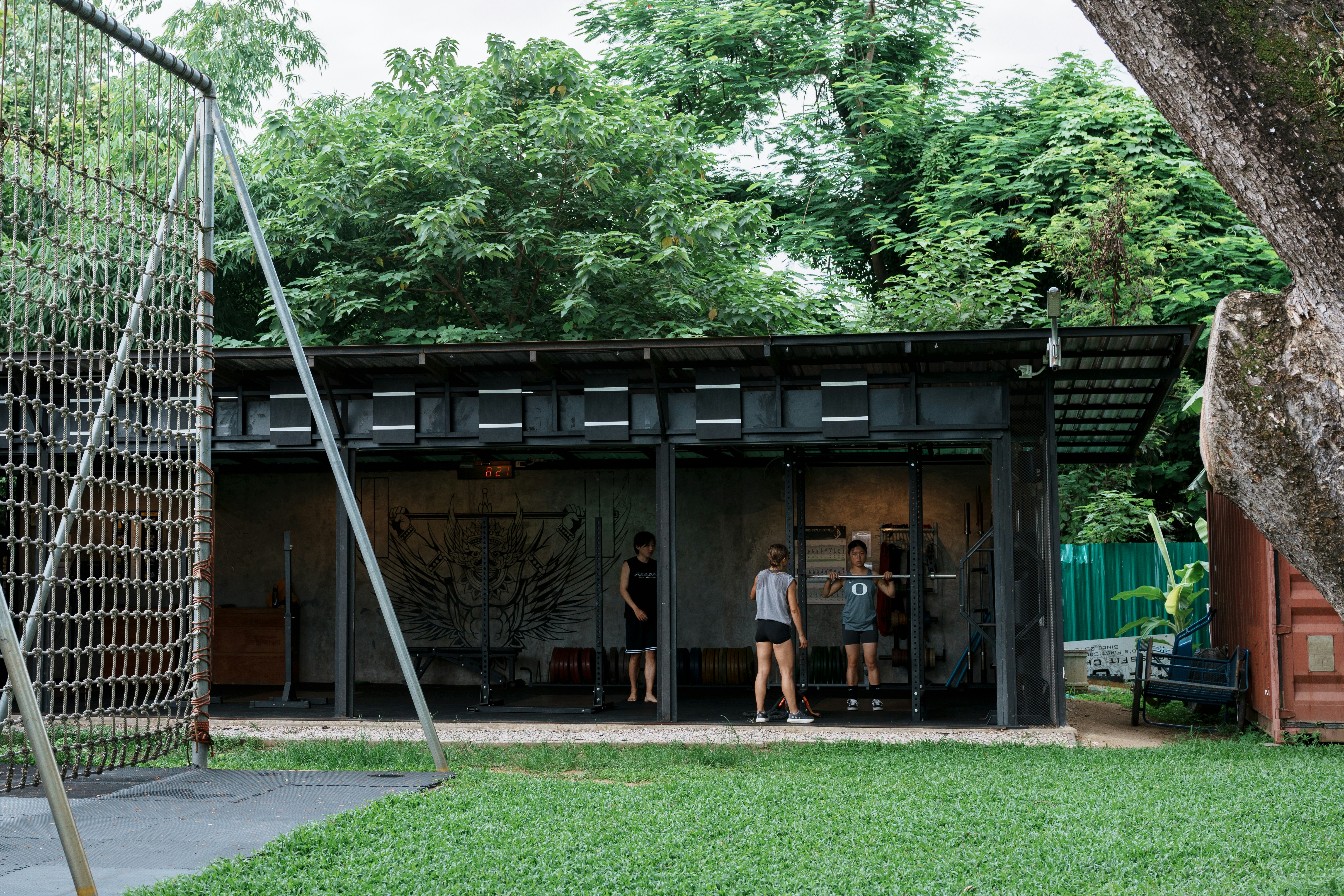 ATLAS 24:7 gym interior with biophilic greenery and premium equipment